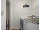 Efficient laundry area with a modern washing machine and space for storage at 6672 S Goldenrod Rd # 132B, Orlando, FL 32822