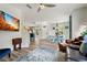 Open-concept living space featuring wood floors, modern furnishings, and a connected kitchen area at 6672 S Goldenrod Rd # 132B, Orlando, FL 32822