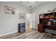Well lit office space featuring wood floors, desk and mini fridge for convenience at 6672 S Goldenrod Rd # 132B, Orlando, FL 32822