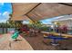 Community playground with shade, various toys, and views of the pond at 6672 S Goldenrod Rd # 132B, Orlando, FL 32822