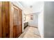 Bathroom with tiled floors, a wooden cabinet, a toilet, and a shower with a curtain at 810 Alex Ln, Deltona, FL 32738