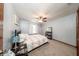 Bedroom with carpeted floor, neutral walls, ceiling fan, and a shelf with a mirror at 810 Alex Ln, Deltona, FL 32738