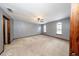 Spacious bedroom featuring neutral color palette, ceiling fan, and two arched windows at 810 Alex Ln, Deltona, FL 32738