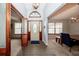 Bright foyer featuring tile entryway and view into the dining and living areas at 810 Alex Ln, Deltona, FL 32738