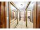 Hallway with mirrored closet doors and views of the rooms and bathrooms that it connects to at 810 Alex Ln, Deltona, FL 32738