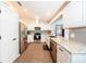 Well-equipped kitchen featuring stainless steel appliances, granite countertops, and ample cabinet space at 810 Alex Ln, Deltona, FL 32738
