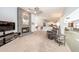Spacious living room featuring a brick fireplace and open access to the kitchen and dining area at 810 Alex Ln, Deltona, FL 32738