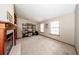Spacious living room featuring a fireplace and built-in bookshelves at 810 Alex Ln, Deltona, FL 32738