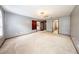 Spacious living room featuring neutral paint, ceiling fan, and doorway to other parts of the house at 810 Alex Ln, Deltona, FL 32738