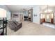 Open concept living room with fireplace, ceiling fan, and doorway to the front entrance at 810 Alex Ln, Deltona, FL 32738