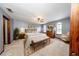 Comfortable main bedroom with a ceiling fan, two windows, an area rug, and neutral colored walls at 810 Alex Ln, Deltona, FL 32738