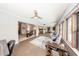 Bright sunroom with multiple windows offering ample natural light and access to other rooms at 810 Alex Ln, Deltona, FL 32738