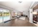 Sun-filled room with sliding glass doors leading to the pool area and views of the backyard at 810 Alex Ln, Deltona, FL 32738