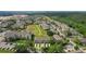 This aerial showcases a community with lush greenery, well-maintained lawns, and convenient parking for residents at 8110 Princess Palm Ln, Kissimmee, FL 34747