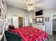 Charming bedroom featuring a full bed with Mickey Mouse-themed bedding and gray wood-look flooring at 8110 Princess Palm Ln, Kissimmee, FL 34747