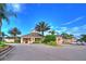 Community clubhouse provides residents with a gathering space and various amenities amidst lush landscaping at 8110 Princess Palm Ln, Kissimmee, FL 34747