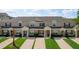 Inviting townhome showcases meticulous landscaping and well-maintained exteriors with a private entrance at 8110 Princess Palm Ln, Kissimmee, FL 34747