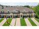 Charming townhome exteriors with manicured lawns, showcasing the lovely community and inviting appeal at 8110 Princess Palm Ln, Kissimmee, FL 34747