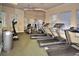 Community gym is equipped with treadmills, an elliptical machine, and weight training equipment at 8110 Princess Palm Ln, Kissimmee, FL 34747