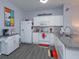 Kitchen area featuring white appliances, countertops, and themed decor at 8110 Princess Palm Ln, Kissimmee, FL 34747