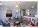 Inviting living room and dining area with themed furniture and decor at 8110 Princess Palm Ln, Kissimmee, FL 34747