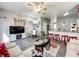 Open-concept living room seamlessly integrates with the kitchen, perfect for modern living at 8110 Princess Palm Ln, Kissimmee, FL 34747