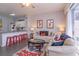 Living room has a neutral color palette and a ceiling fan, plus decor and art based on Disney's Mickey Mouse at 8110 Princess Palm Ln, Kissimmee, FL 34747