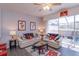 Cozy living room filled with natural light and comfortable seating near the screened-in pool at 8110 Princess Palm Ln, Kissimmee, FL 34747