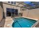 Relaxing screened-in pool area featuring an inviting pool, patio seating, and plenty of space for outdoor enjoyment at 8110 Princess Palm Ln, Kissimmee, FL 34747