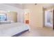Bright bedroom featuring mirrored closet doors, plush carpet, and access to an en-suite bathroom at 900 Northern Dancer # 204, Casselberry, FL 32707