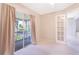 Serene bedroom with a private balcony, offering a tranquil retreat and seamless indoor-outdoor living at 900 Northern Dancer # 204, Casselberry, FL 32707