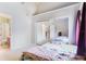 Bedroom features ensuite bathroom and large mirrored closet doors at 900 Northern Dancer # 204, Casselberry, FL 32707