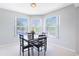 Cozy dining area featuring a table with seating and large windows offering scenic views at 900 Northern Dancer # 204, Casselberry, FL 32707