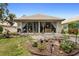 The backyard features a patio, garden, and plenty of space for outdoor enjoyment at 9049 Saint Andrews Way, Mount Dora, FL 32757