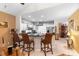 Bright, open kitchen design featuring an island with seating and modern appliances at 9049 Saint Andrews Way, Mount Dora, FL 32757