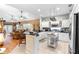 Bright kitchen with stainless steel appliances, tile floors, and an island with seating at 9049 Saint Andrews Way, Mount Dora, FL 32757