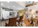 Well-appointed kitchen featuring granite counters, a central island, and seamless access to the living area at 9049 Saint Andrews Way, Mount Dora, FL 32757