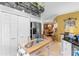Bright kitchen featuring ample storage, stainless steel appliances, and a convenient central island at 9049 Saint Andrews Way, Mount Dora, FL 32757