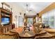 Warm living room featuring comfortable sofas, a ceiling fan, and an inviting atmosphere for relaxation at 9049 Saint Andrews Way, Mount Dora, FL 32757