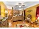 Inviting main bedroom features stylish décor, hardwood floors, and a ceiling fan for added comfort at 9049 Saint Andrews Way, Mount Dora, FL 32757