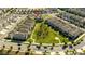 Beautiful aerial view of the neighborhood with large green space and well-maintained homes at 10038 Verse Aly, Winter Garden, FL 34787