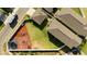 Aerial view of a property showcasing a fenced backyard with grass, play areas, trampoline and a lush garden at 10038 Verse Aly, Winter Garden, FL 34787