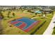 Scenic view of a basketball court with a colorful surface, nestled in a community park and green space at 10038 Verse Aly, Winter Garden, FL 34787