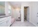 Open-concept bathroom with a shower, large vanity, and a plush bench at 10038 Verse Aly, Winter Garden, FL 34787
