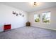 Bright bedroom with two windows that offer outside views and neutral carpet at 10038 Verse Aly, Winter Garden, FL 34787