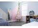 Teen bedroom with a hanging chair, grey carpet, and modern wall decor at 10038 Verse Aly, Winter Garden, FL 34787