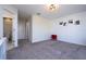 This is a bedroom with grey carpet, white walls and a decorative ceiling fan at 10038 Verse Aly, Winter Garden, FL 34787