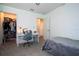 Bedroom featuring desk area, closet, and adjacent open doorway at 10038 Verse Aly, Winter Garden, FL 34787
