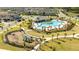 Aerial perspective of a vibrant community showcasing the pool, playground, and meticulously maintained landscaping at 10038 Verse Aly, Winter Garden, FL 34787