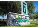Landscaped community entrance sign reading 'Storey Grove' creates a welcoming and distinguished arrival experience at 10038 Verse Aly, Winter Garden, FL 34787